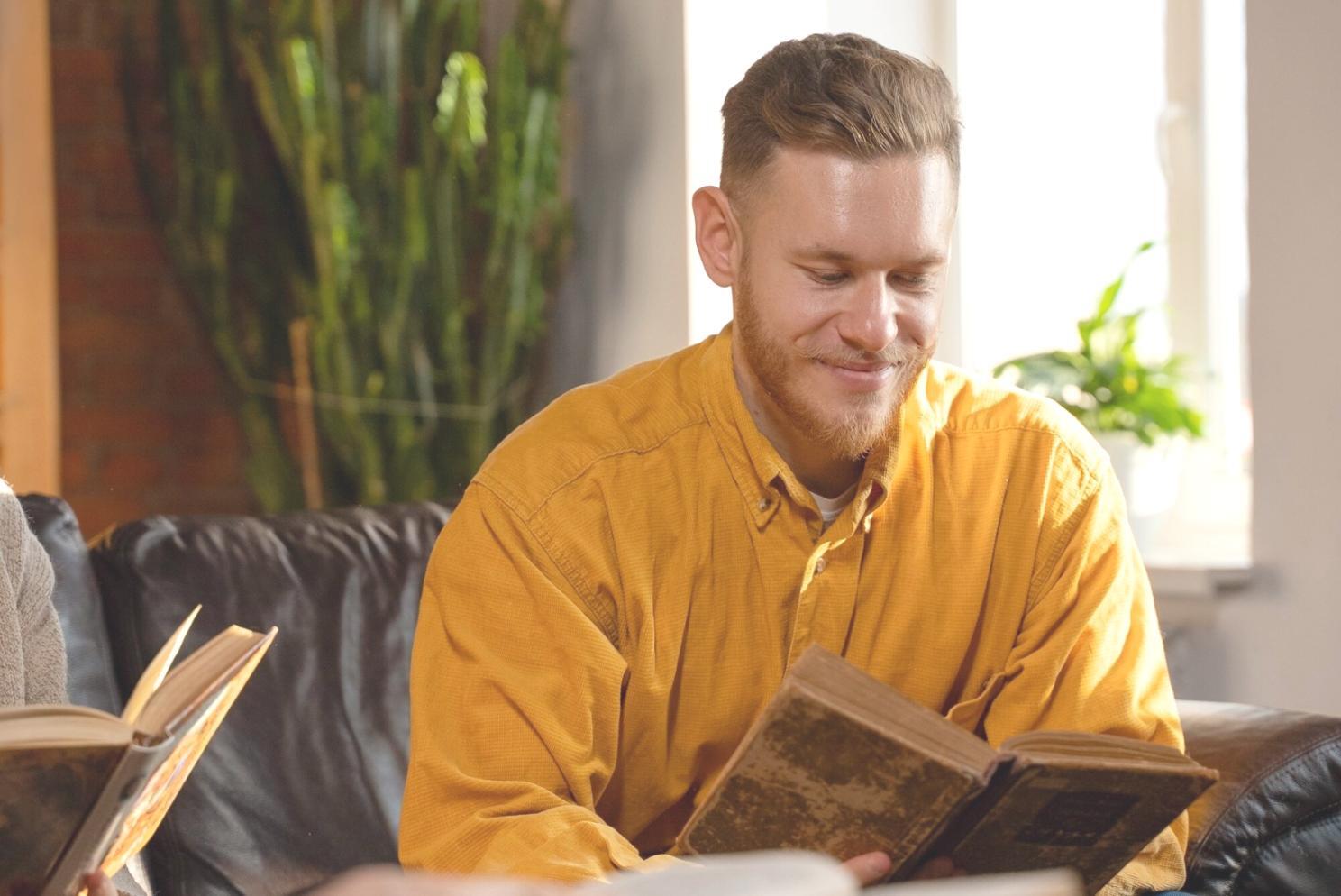 Person reviewing financial documents and budget planning materials